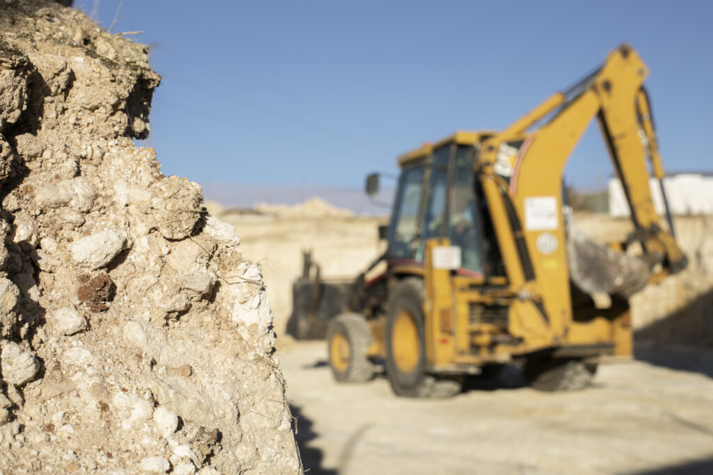 excavator digging ground day light excavator digging ground day light